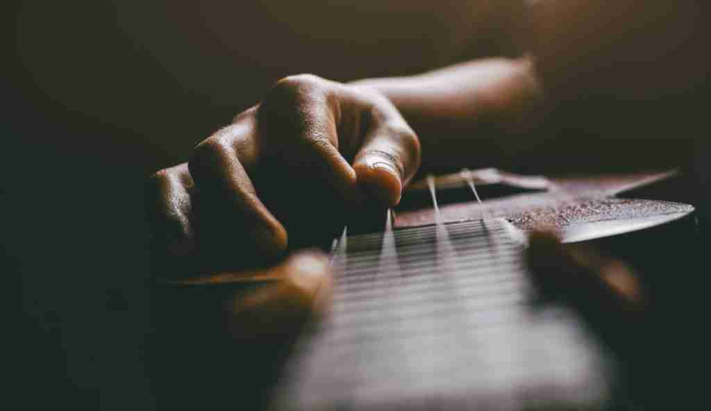 hands-playing-acoustic-ukulele-guitar-music-skills-show